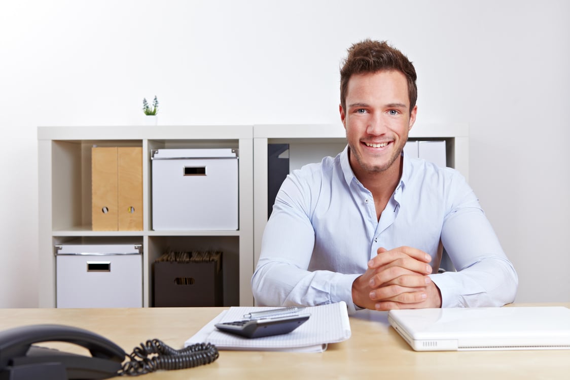 Smiling Business Consultant in Office